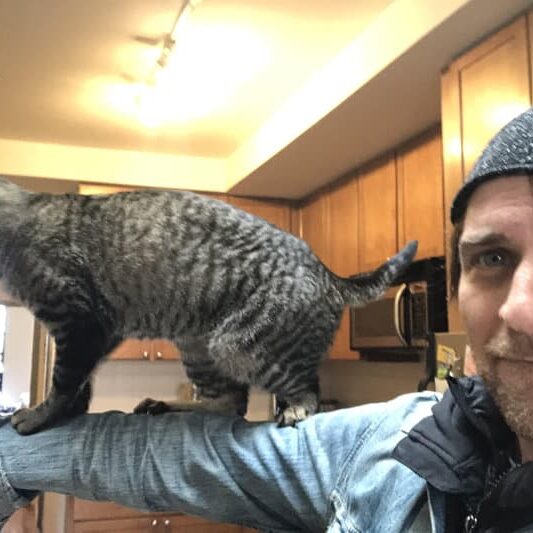 Kevin Rooney and his cat Eric